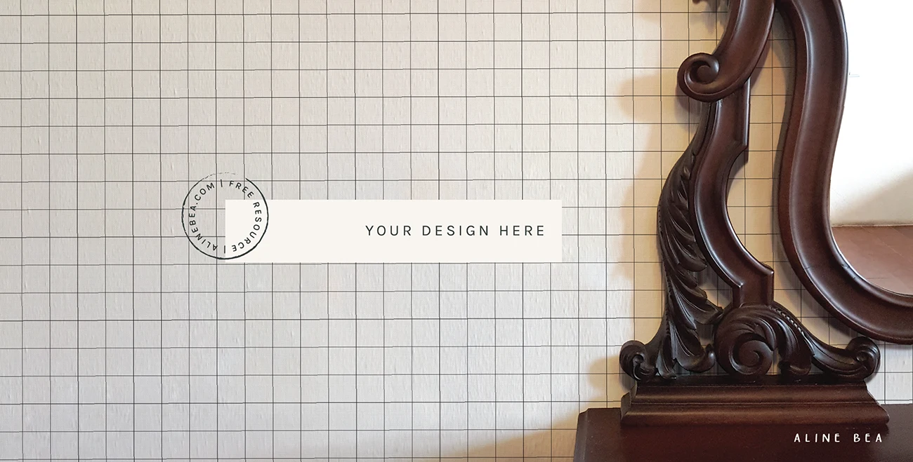 'Your design here' written on wallpaper