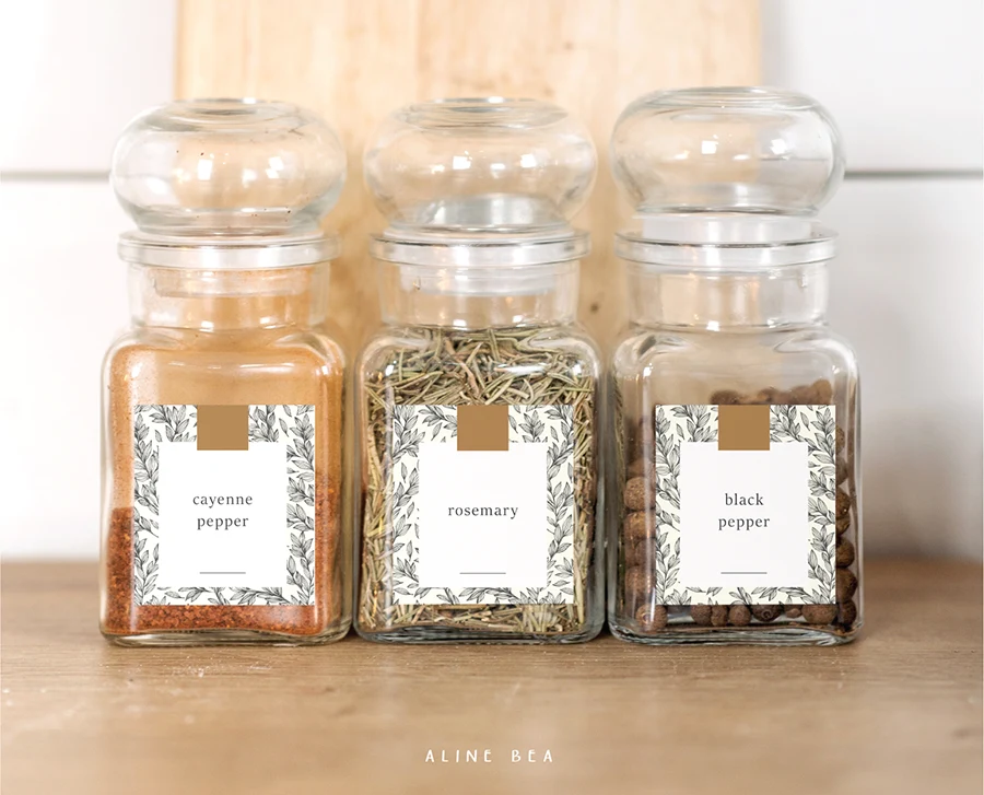 Spice jars with labels designed by Aline Bea