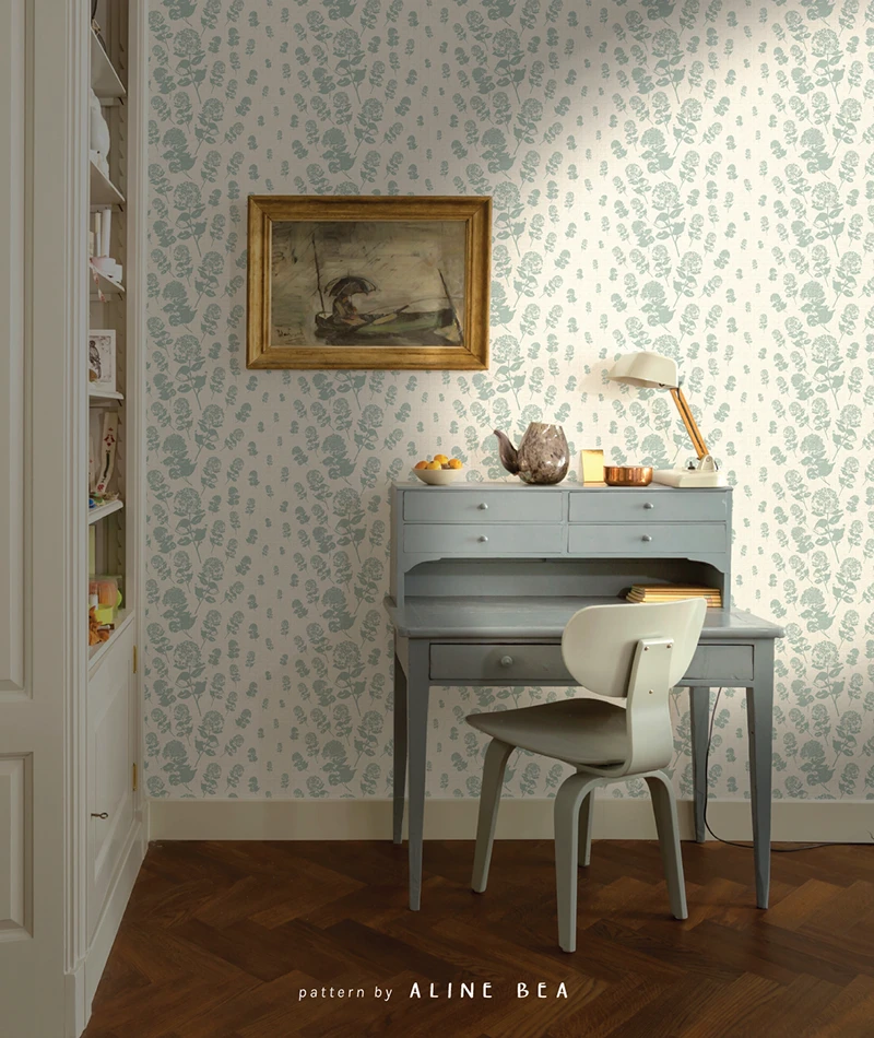floral pattern design by Aline Bea applied to wallpaper, on a living room