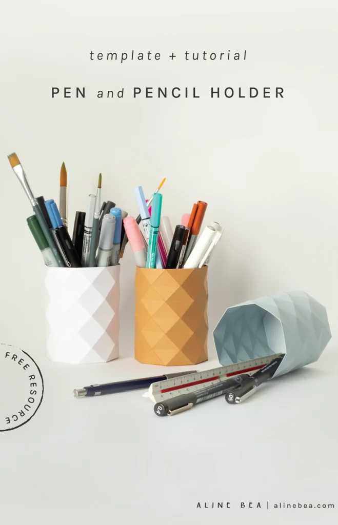 Geometric pen and pencil holders made of paper in different colors.
