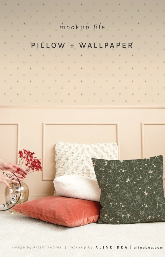 Set of four pillows on the floor of a living room, in front of a wall with wallpaper.