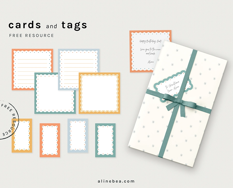 Set of printable notecards and tags, alongside a gift box, wrapped on a wrapping paper with a lace and a tag on top. The Notecards and tags have a colorful graphic border around them.