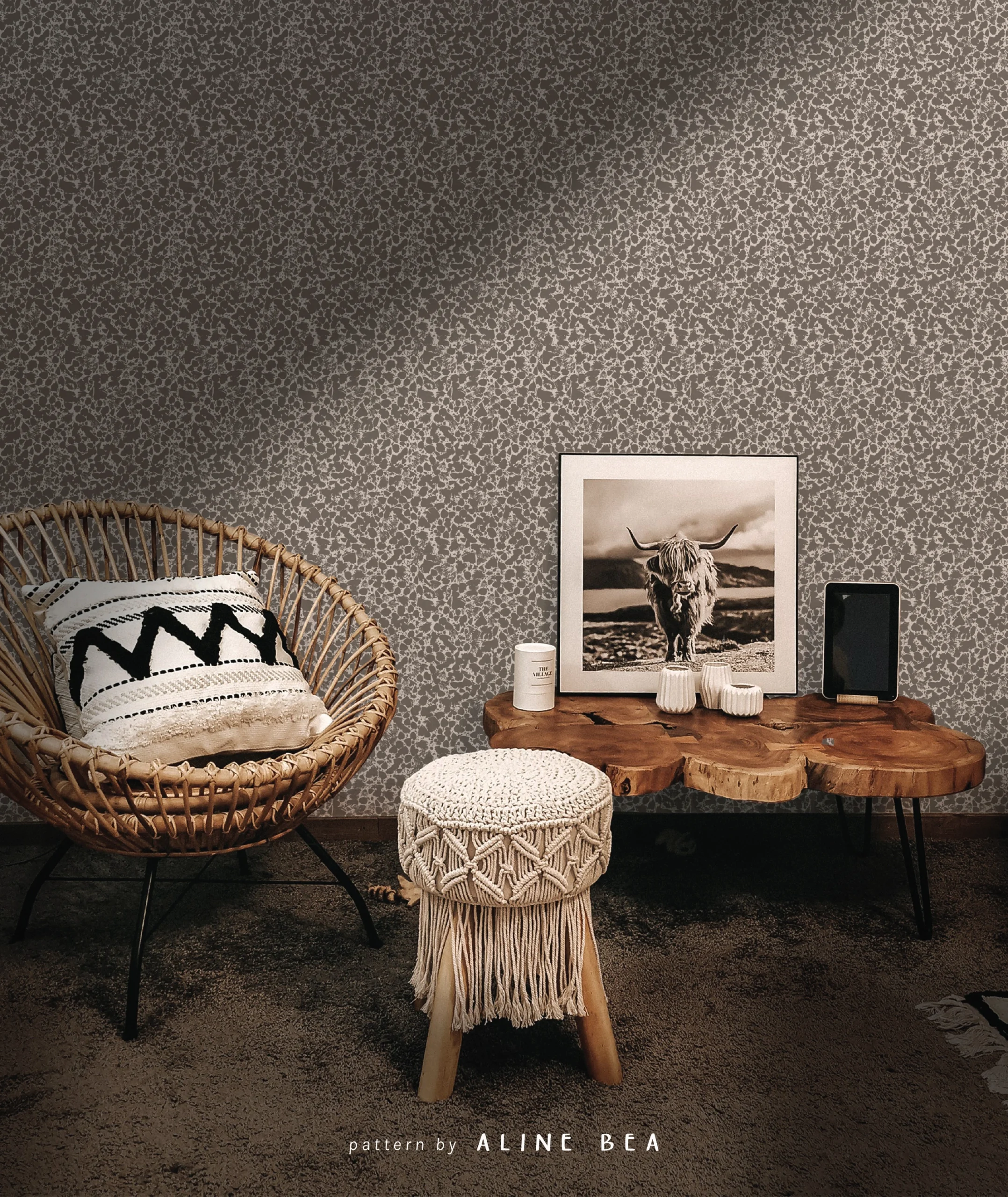 Farmhouse interior scene, displaying a wall covered by textured wallpaper by Aline Bea, a chair with a pillow, a wooden small coffee table and a small wooden bench.
