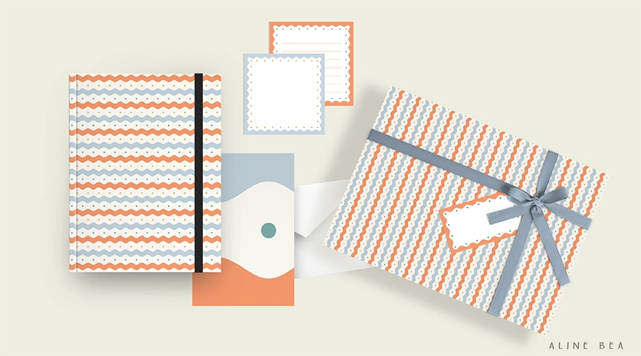 Stationery kit containing a notebook, a greeting card, note cards, and a gift wrapping paper.