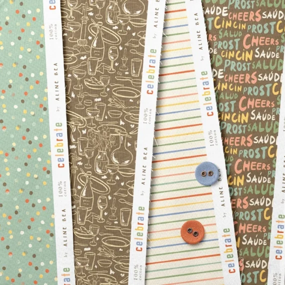 Set of folded fabric with Celebrate collection's patterns by Aline Bea