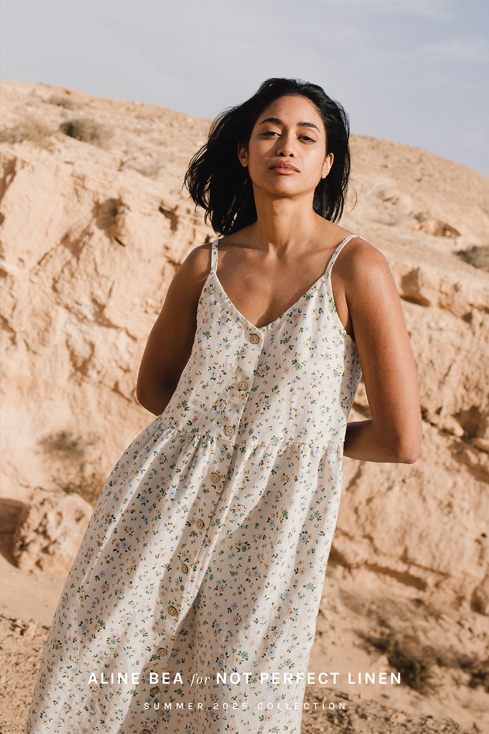 Model-wearing-floral-sleeveless-linen-dress-by-Not-Perfect-Linen-withh-Aline-Beas-floral-paterrn.