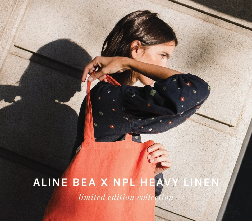 Woman-a-dress-from-Aline-Bea-X-Not-Perfect-Linen-heavy-linen-collection