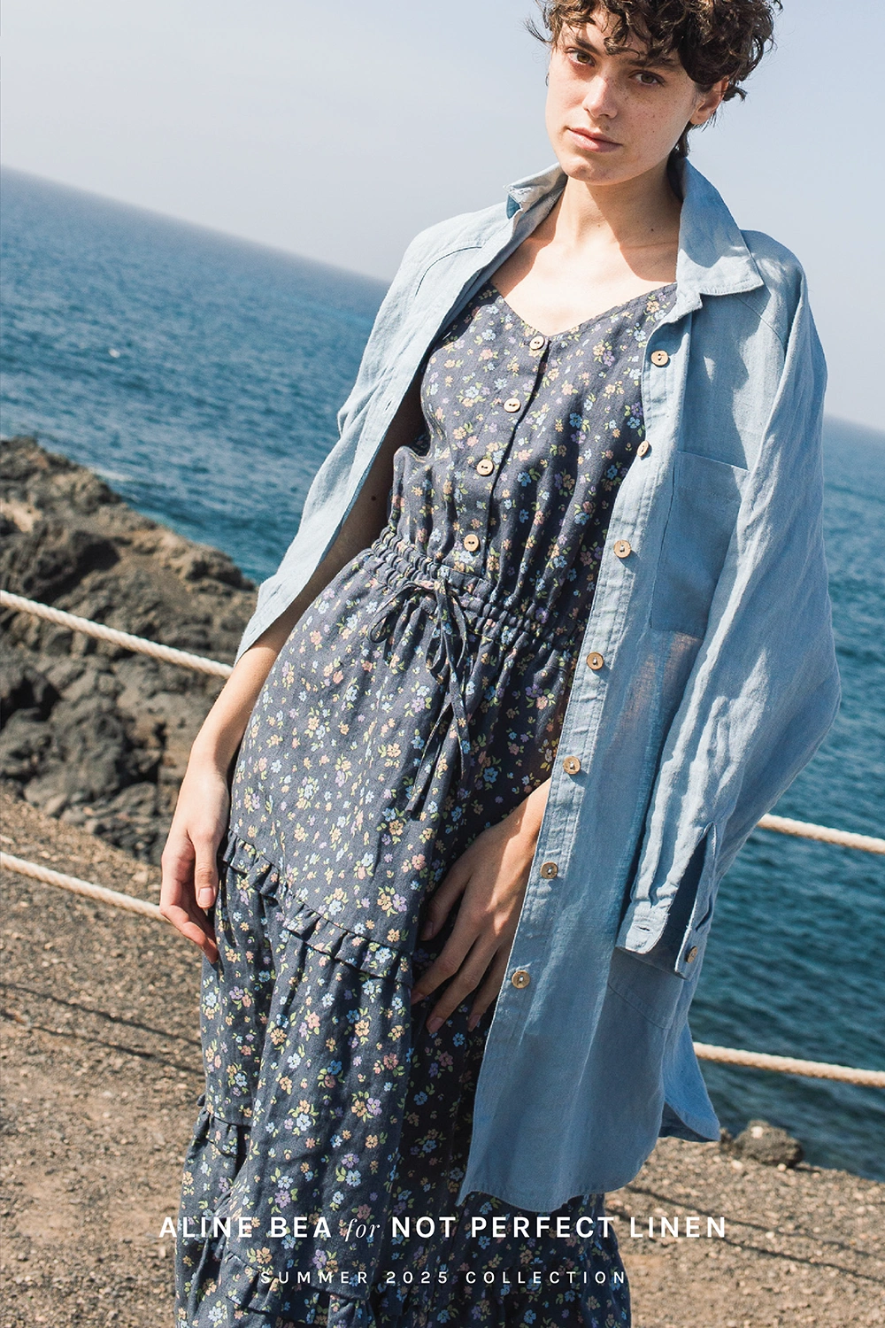 Model-wearing-sustainable - linen-garment-by-Not-Perfect-Linen-with-Aline-Beas-floral-pattern-by-the-sea.