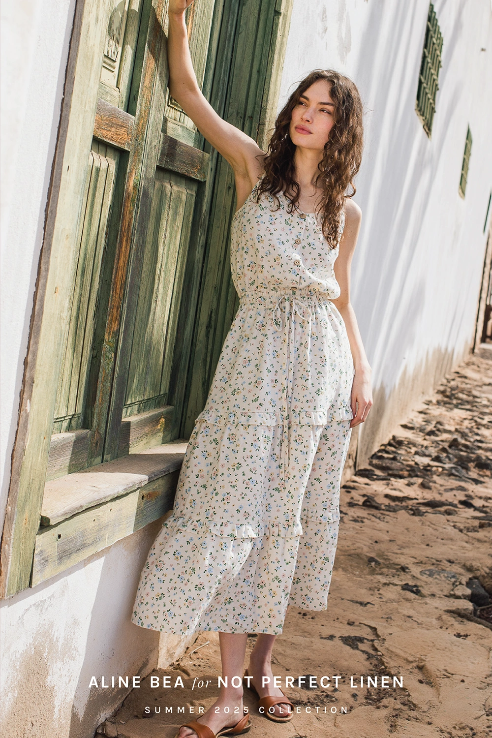 Model-wearing-summer-dress-by-Not-Perfect-Linen-with-Aline-Beas-floral-pattern-in-calm-slow-life-aesthetic.