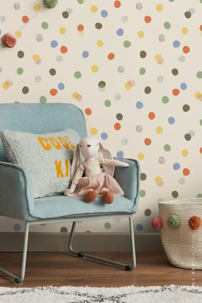 Cream wallpaper with multicolor confetti dots in a children's playroom