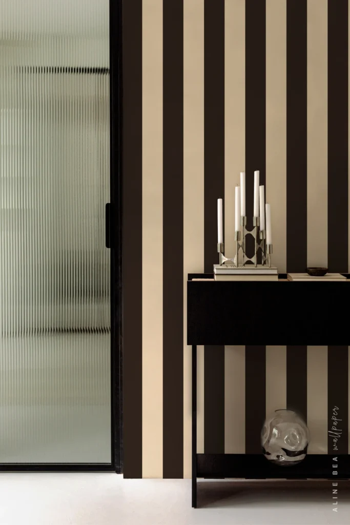 Espresso brown and cream vertical stripe wallpaper in a contemporary hallway entryway