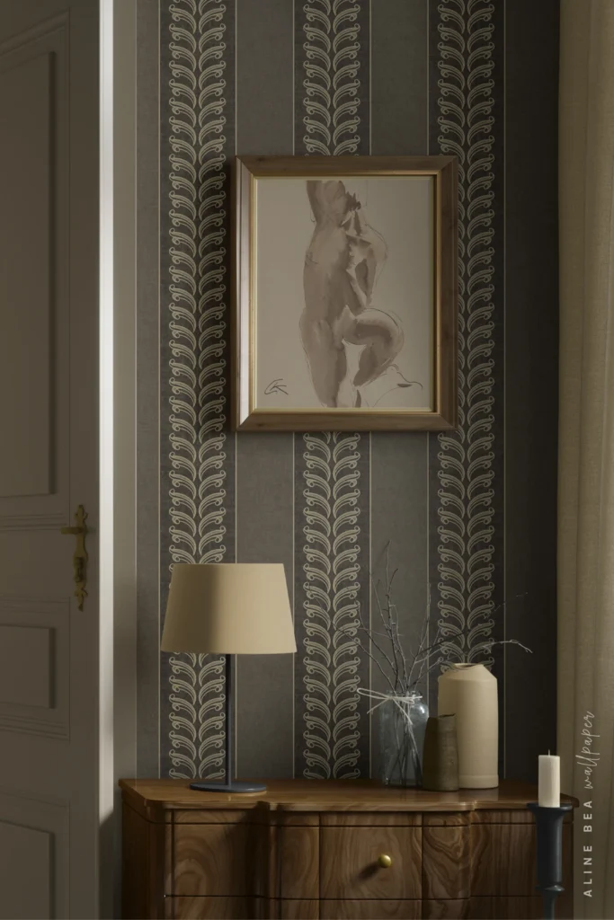 Charcoal grey striped wallpaper with an ornate cream scroll motif in an entryway