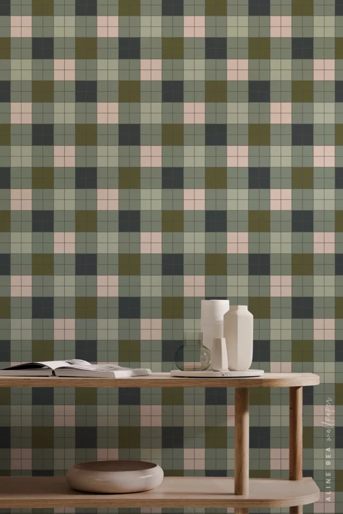 Olive green and blush plaid check wallpaper behind a wooden console table