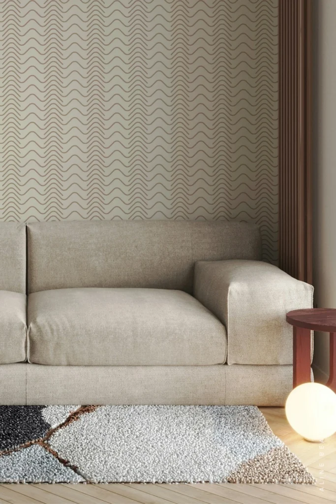 Cream wallpaper with a subtle wavy zigzag line pattern in a minimalist living room