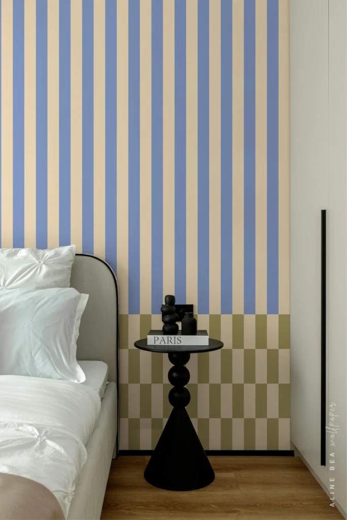 Blue and cream striped wallpaper with an olive checkerboard border in a bedroom