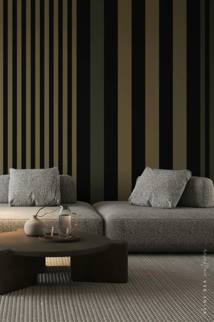 Black, olive, and cream vertical stripe wallpaper in a moody living room