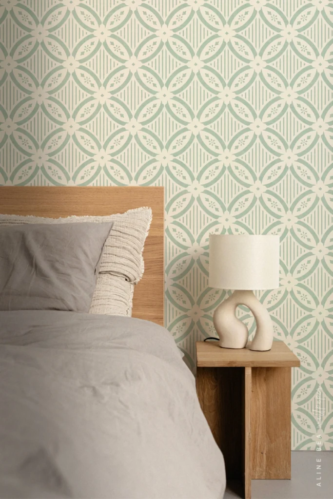 Sage green and cream quatrefoil tile-pattern wallpaper in a bedroom