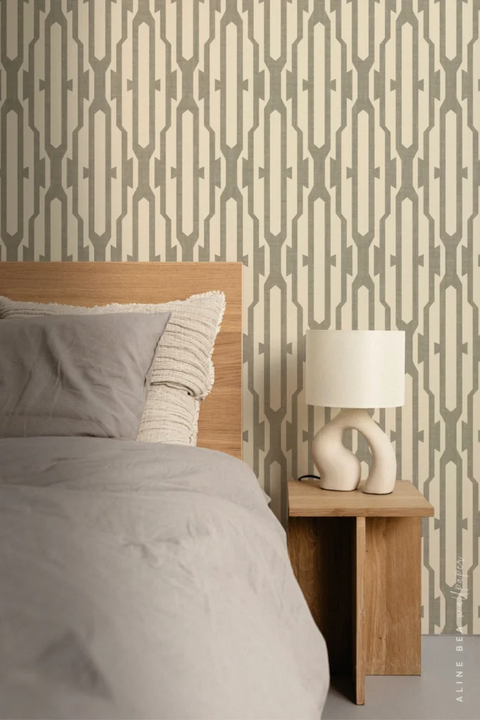 Grey and cream interlocking geometric chain-link pattern wallpaper in a minimalist bedroom