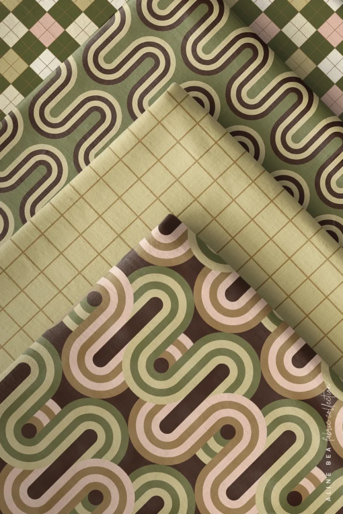 Four fabric swatches folded and stacked diagonally: an olive-green, pink, and cream intertwined stripes on top, a simple grid in beige, a warm olive-and-brown flowing wave print beneath it, and a light olive windowpane grid fabric showing through, with a brown-and-pink wave print visible at the bottom fold.